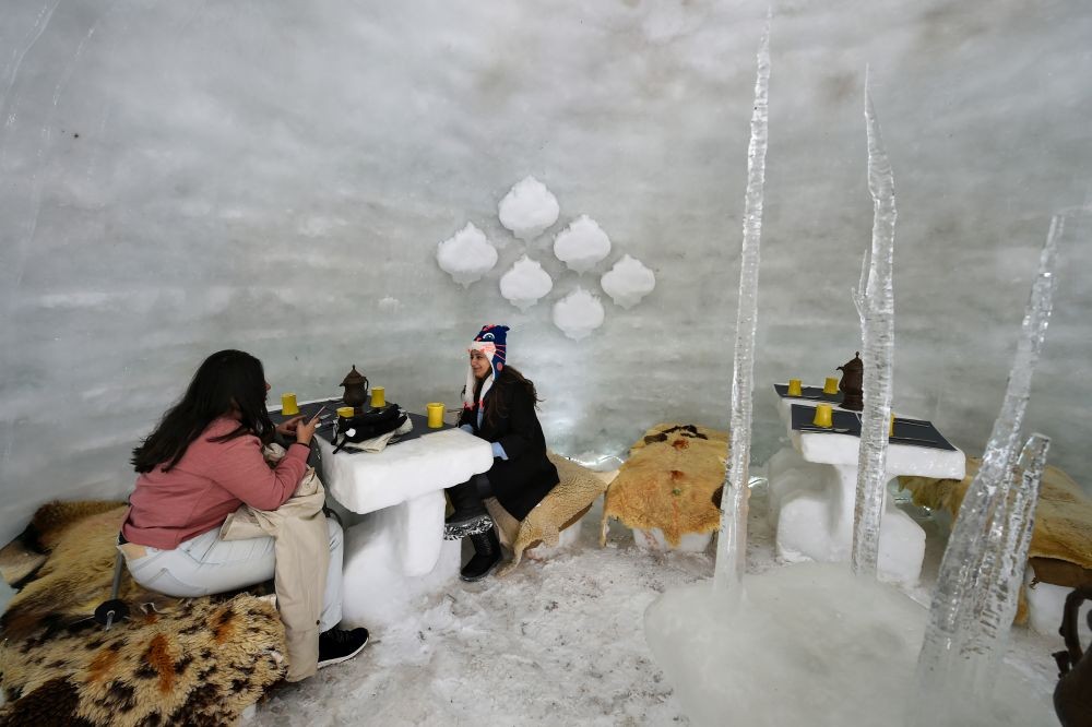 Gulmarg: Guests have tea and breakfast inside an Igloo, made by Kolahoi Green Hotel and Resorts, in Gulmarg, Saturday, Feb. 6, 2021. (PTI Photo/S. Irfan)